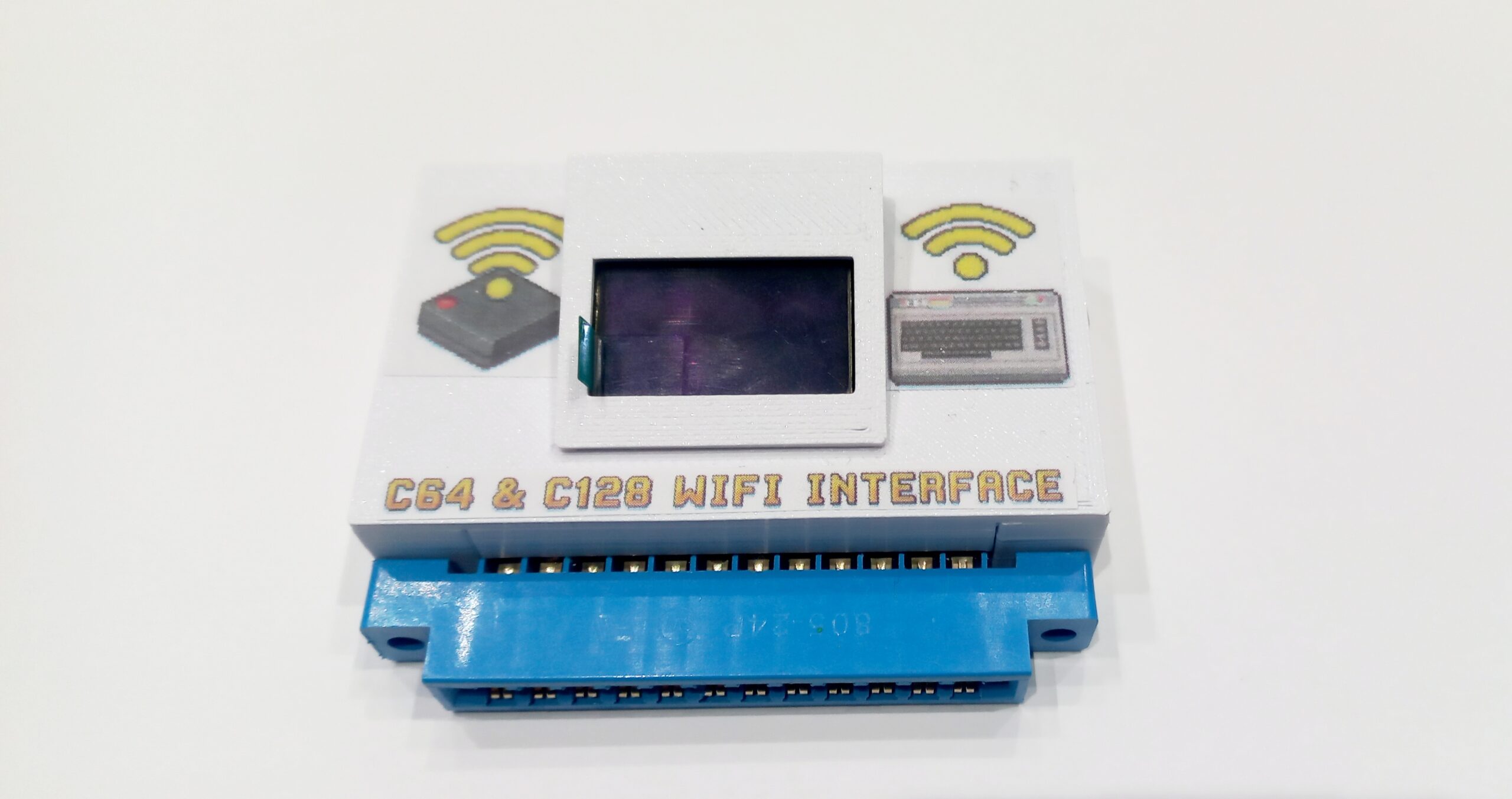 modem-wifi-display-oled-commodore-64 Modem Wi-Fi wireless per porta utente Commodore 64 con display OLED integrato per connessione BBS.